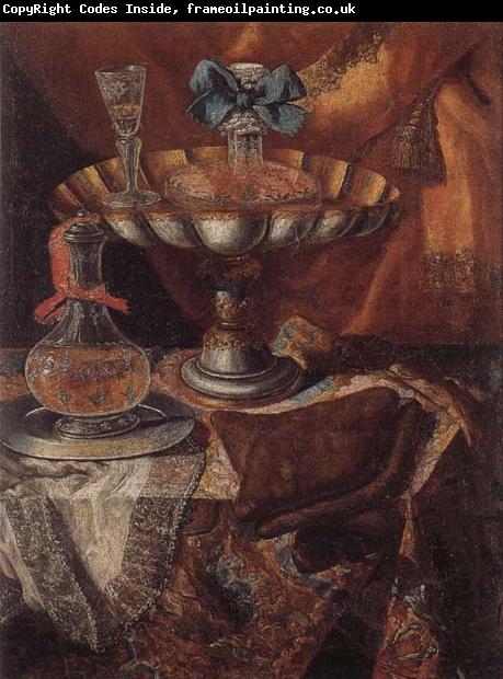 unknow artist Still life of a wine glass and bottle in a parcel gilt tazza together with a glass decanter on a pewter dish upon a draped tabletop